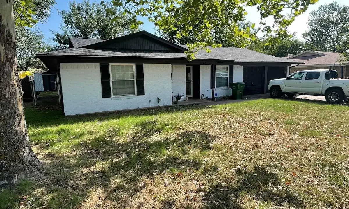 Professional roofing crew working on a residential roof in Asbury Park